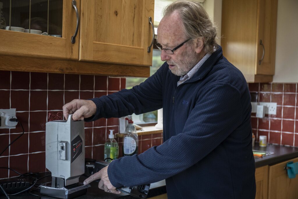 Paddy Lane of Mallow, Co. Cork charging an electric bicycle battery in his home.