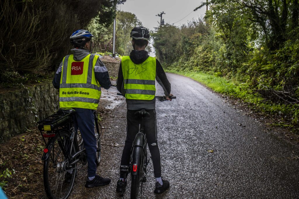 Conor O’Callaghan and his younger brother, Cormac, of Kinsale, County Cork on a country road with their electric bicycles.