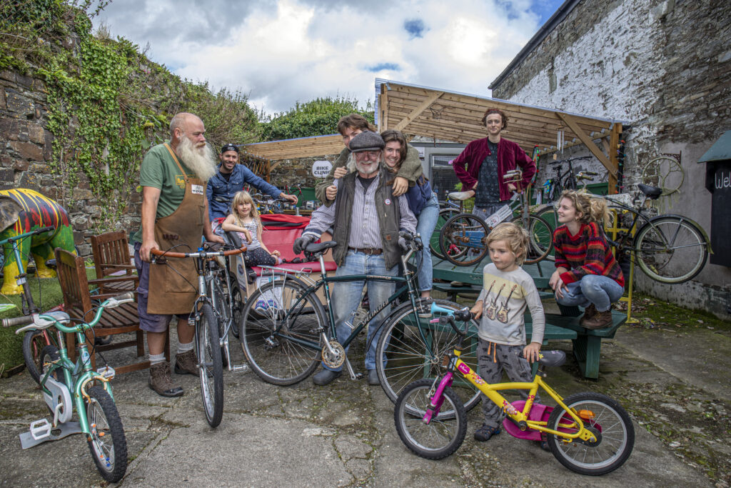 Jack Kelleher of Clonakilty, West Cork surrounded by people and with his electric bicycle.