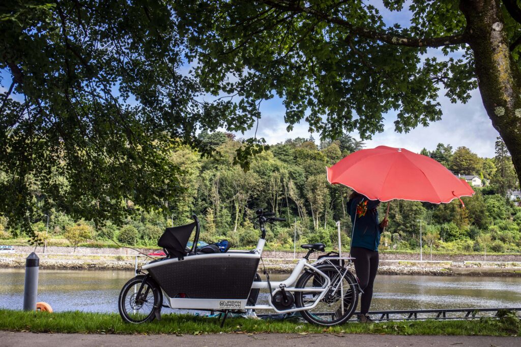 Orla Burke of Cork with her electric cargo bicycle with a parasol at the Marina in Cork.