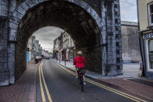Teresa Watkins of Youghal, Co. Cork cycling her electric bicycle in Youghal town centre.