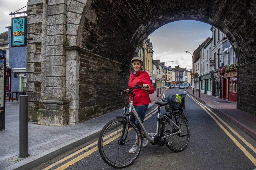Teresa Watkins of Youghal, Co. Cork with her electric bicycle in Youghal town centre.